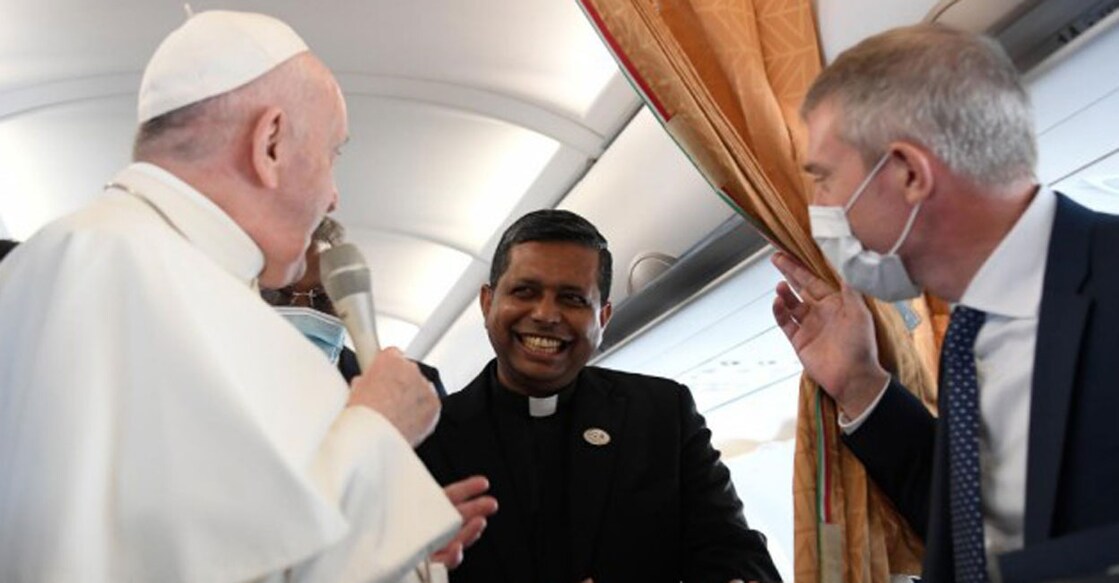 Monsignor George Jacob Koovakkad (centre) with Pope Francis on a flight from Rome to Budapest in September 2021. File photo: Vatican