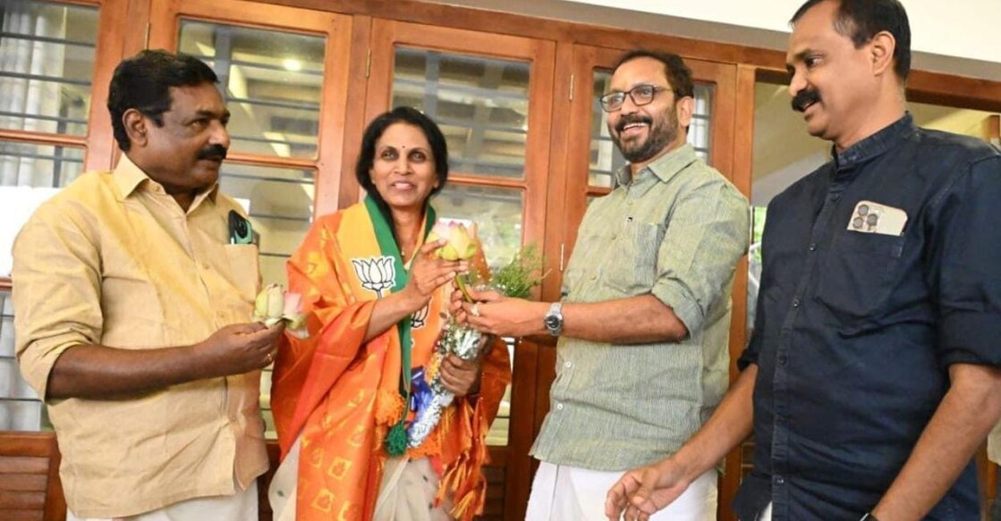 R Sreelekha receives the party membership from BJP state president K Surendran at her residence on Wednesday. Photo: Special Arrangement