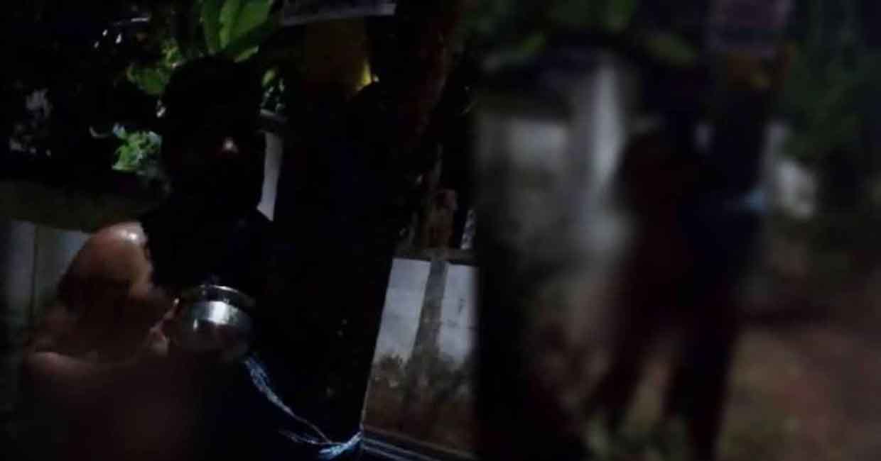 Video grab of the man being assaulted at Thenmala in Kollam. Photo: Manorama Online