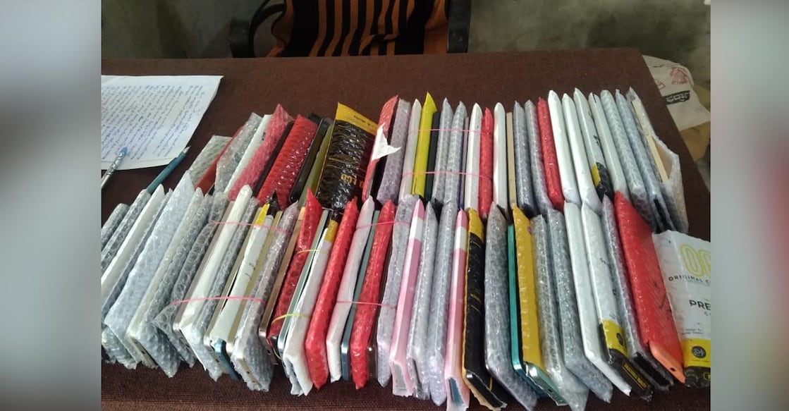 The officials seized as many as 75 branded mobile phones in the raid. Photo: Special Arrangement.