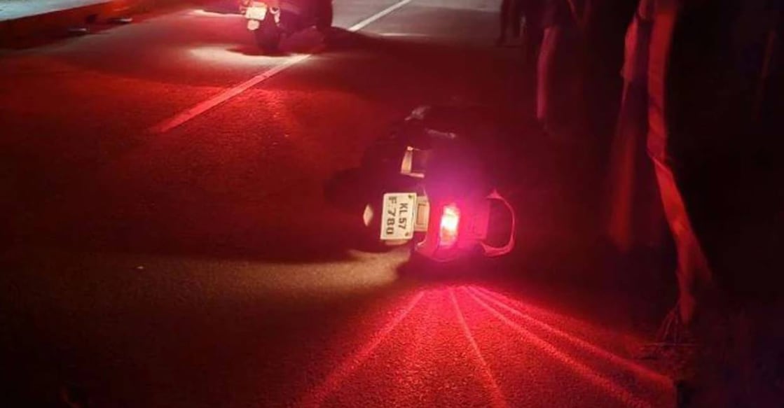 Baiju's scooter knocked down by the robbers. Photo: Manorama News