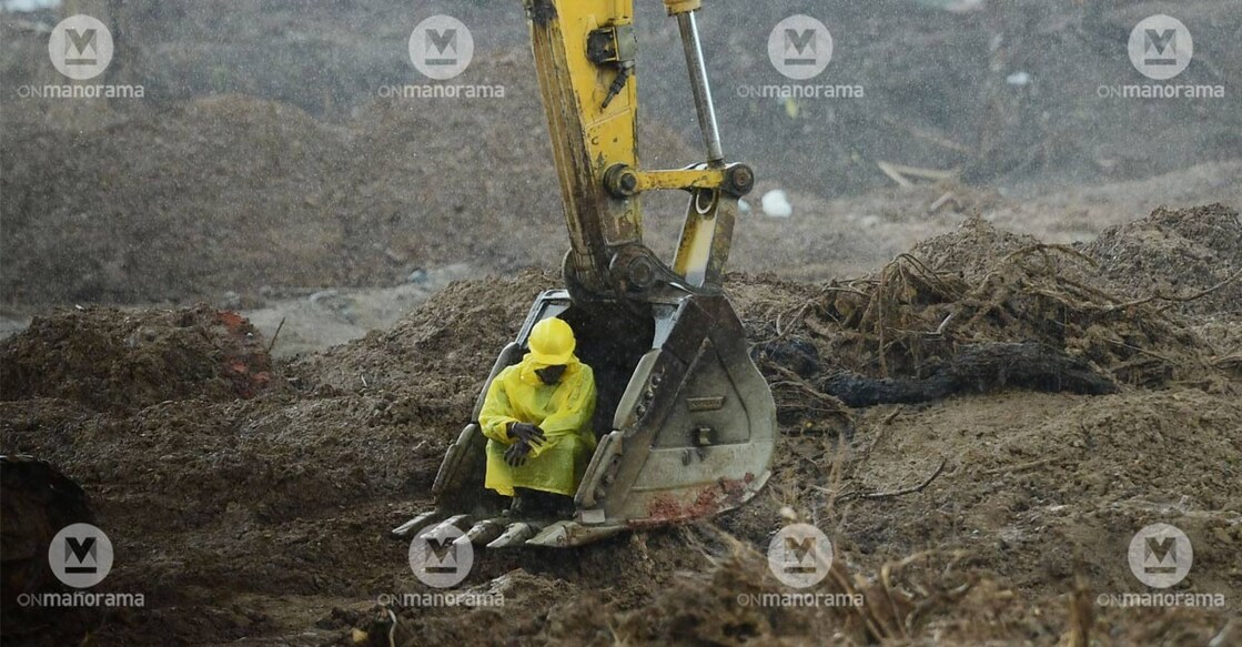 A weary rescuer takes a moment to rest amidst the challenging operations in the landslide-affected region of Wayanad. File Photo: Manorama.