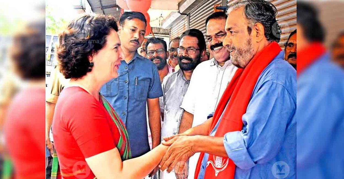 UDF candidate Priyanka Gandhi and LDF candidate Sathyan Mokeri exchange handshakes in Wayanad. Photo: Manorama