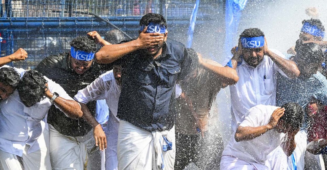 KSU activists face water cannons used by the police to disperse them during their protest march. Photo: PTI
