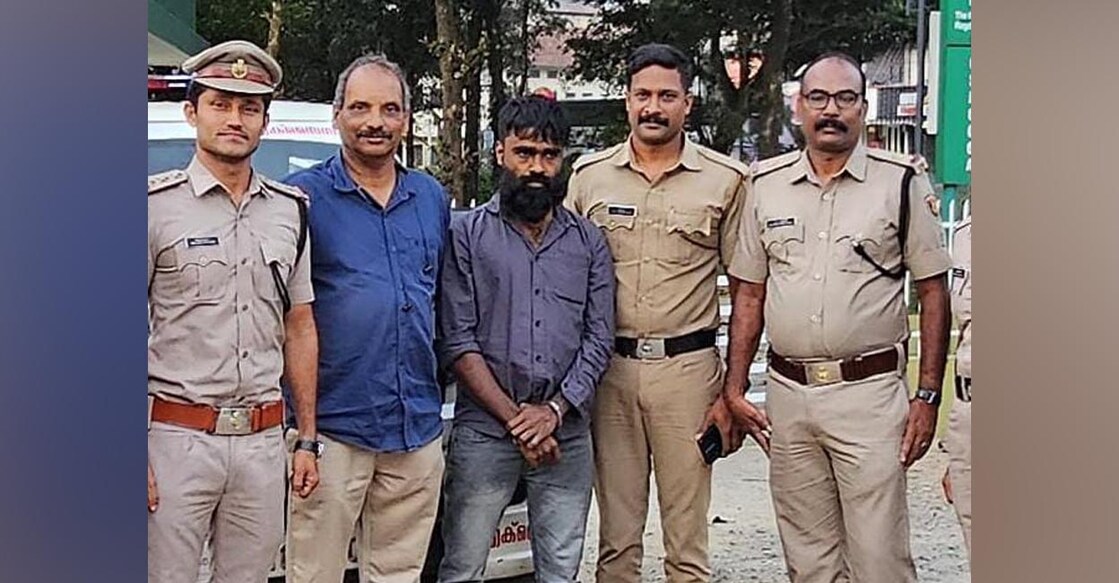 Shahnas (middle) with police and excise personnel. Photo: Special Arrangement.