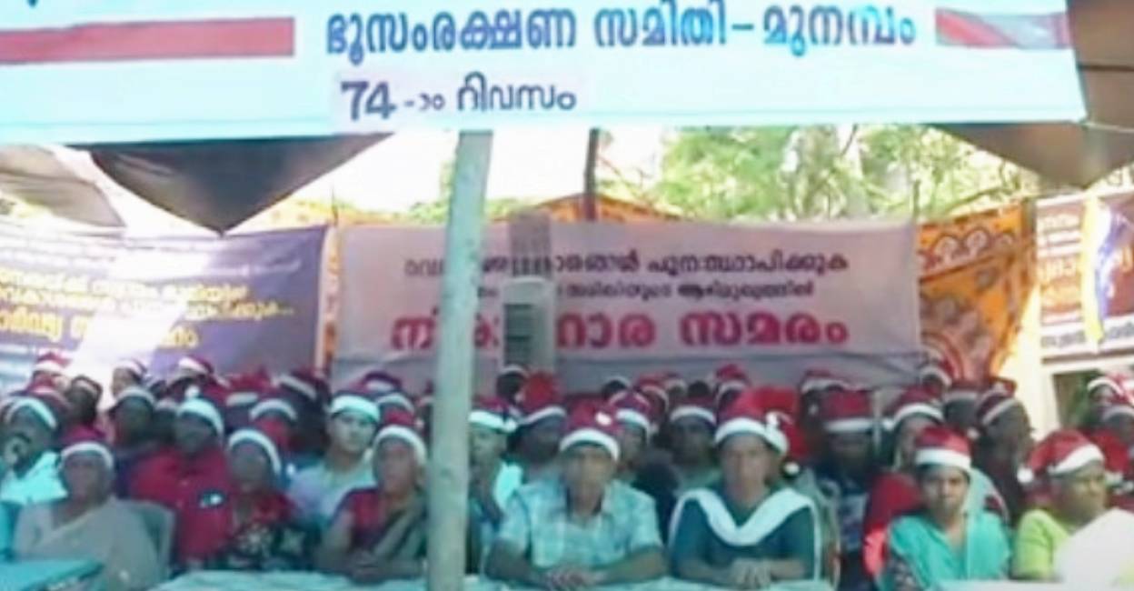 People stage protest at Munamabam on Christmas day. Photo:Screengrab/ Manorama News