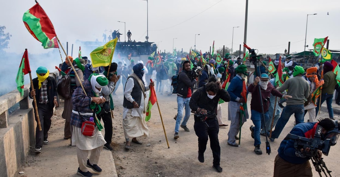 delhi chalo Tear gas being used to disperse protesting farmers at Shambhu Border during their foot march towards Delhi, in Patiala district. Photo: PTI/Shiva Sharma.
