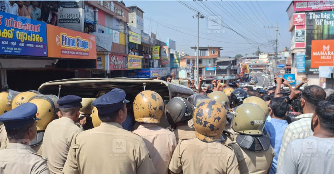 Police confront angry protesters at Pulpally in Wayanad on Saturday. 