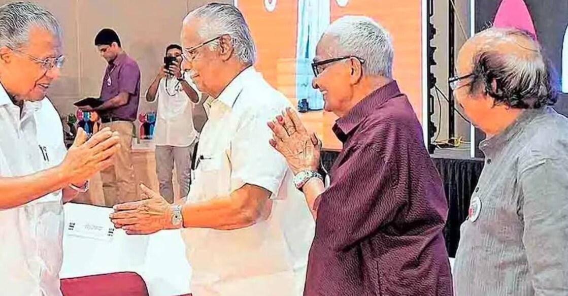 Chief Minister Pinarayi Vijayan greets T Padmanabhan at Mukhamukham programme. Photo: Manorama