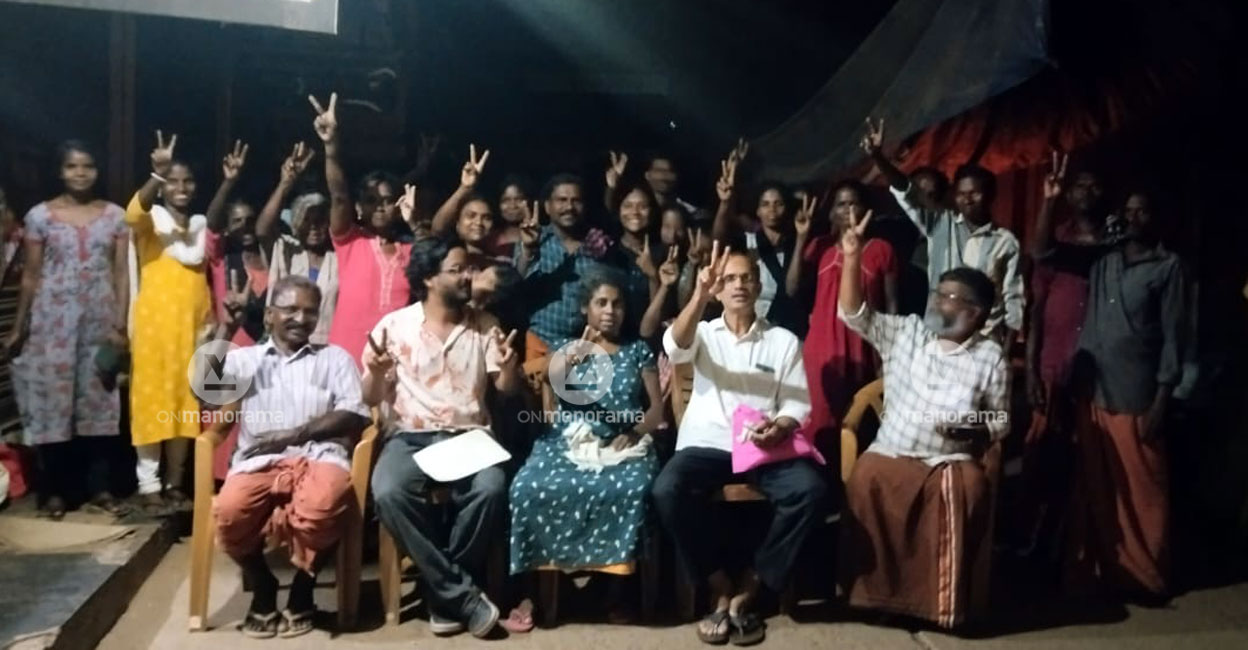 Bindu Vailassery (front row, green dress) shows the victory sign along with fellow protesters in Nilambur Monday evening. Photo: Special arrangement