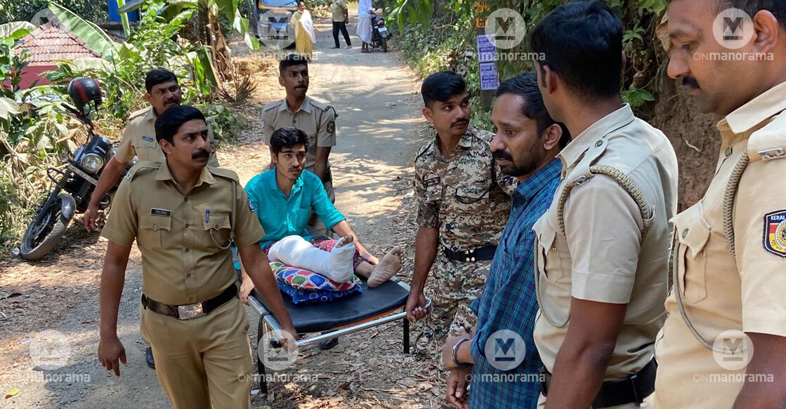 The accused Vishnu (on a stretcher) and Nitheesh during evidence collection at Kakkattukada near Kattapana in Idukki on Wednesday. Photo: Special arrangement/Akhil Philip