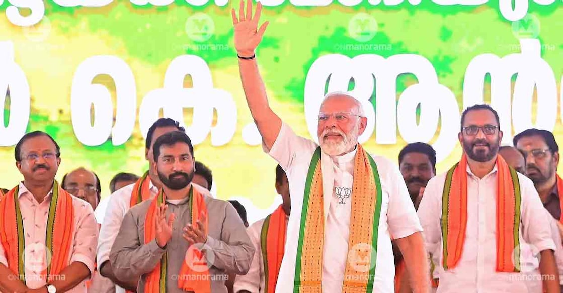 modi-pathanamthitta-anil-antony-surendran Prime Minister Narendra Modi waves at the audience during the Pathanamthitta election campaign. Union Minister V Muraleedharan, NDA candidate Anil Antony and BJP State President K Surendran seen beside Prime Minister. Photo: Nikhilraj/Manorama