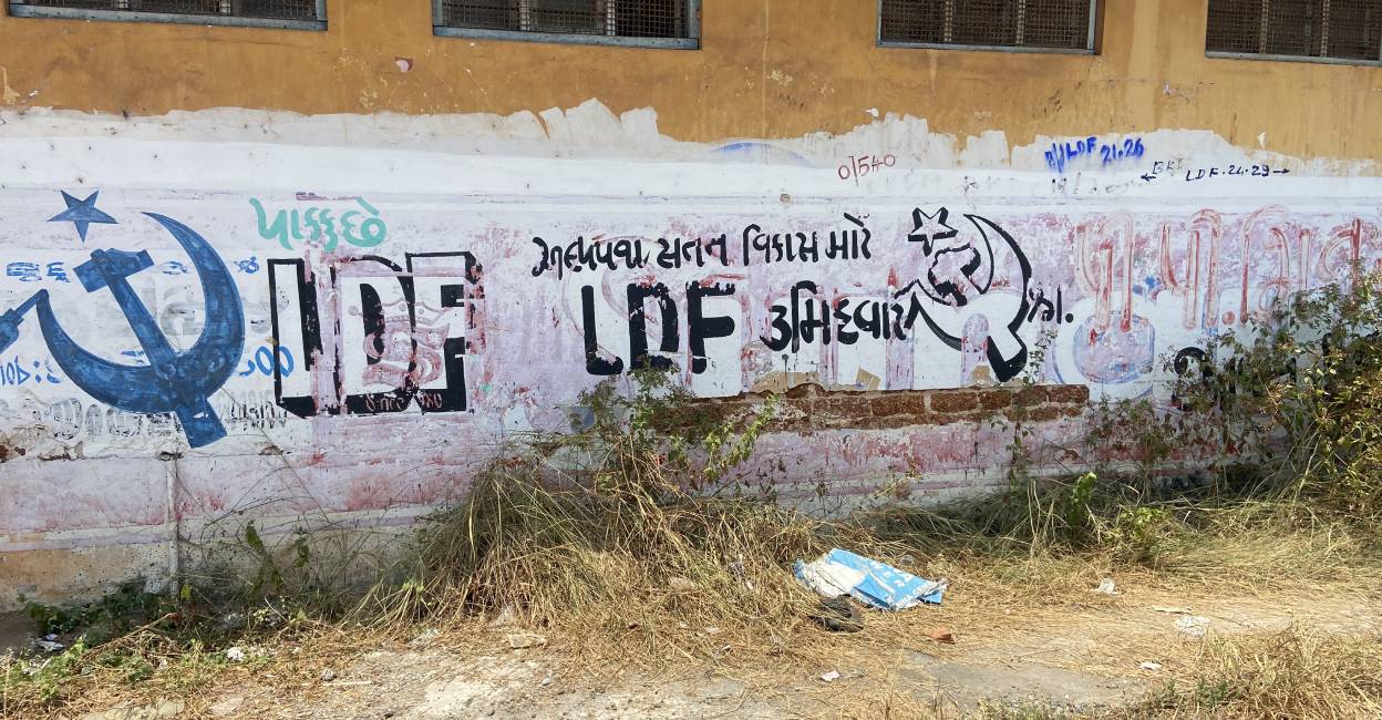 LDF's writings in Gujarati for the last assembly polls still adorn the walls of the buildings in the street. Photo: Special Arrangement
