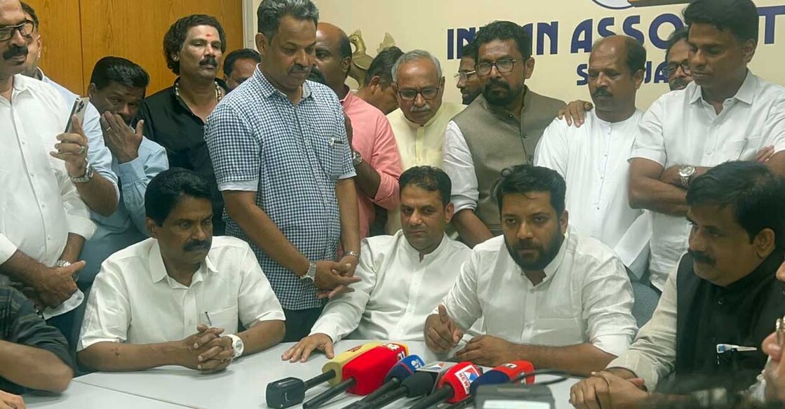 Shafi Parambil is surrounded by members of the NRK community in Sharjah as he attends a press conference. Photo: Special arrangement