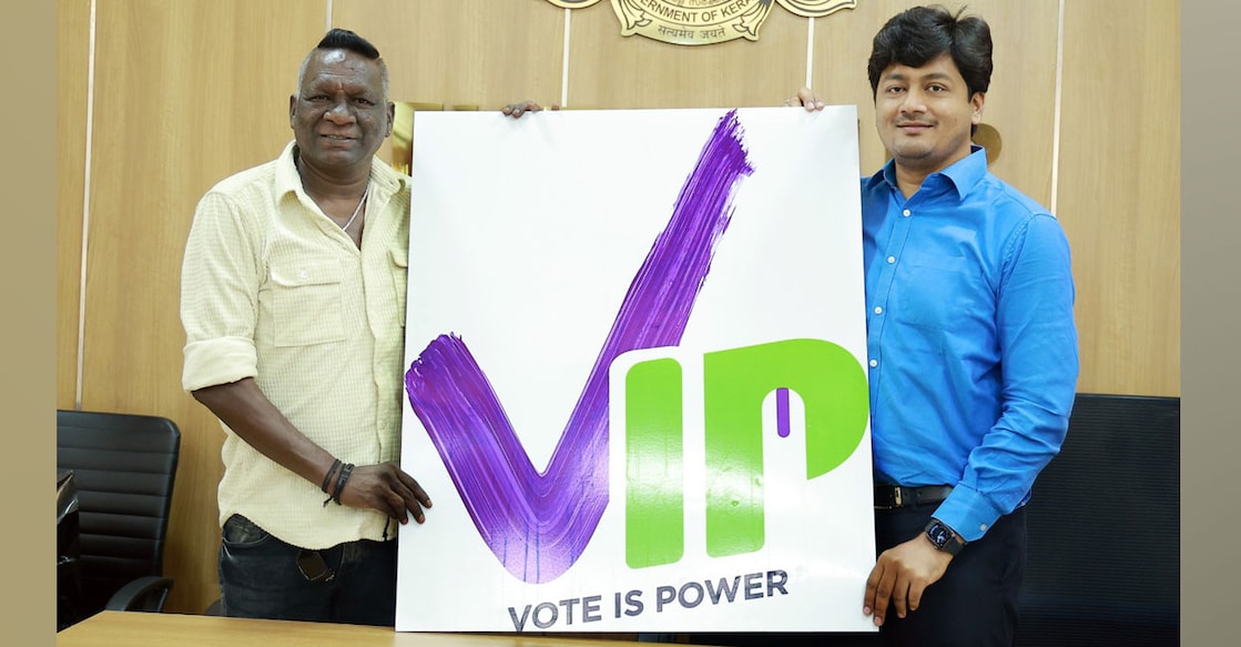im-vijayan-vote-is-power-poster Football legend I M Vijayan unveils the VIP (Vote Is Power) campaign in the presence of Thrissur District Collector V R Krishna Teja. Photo: Special arrangement