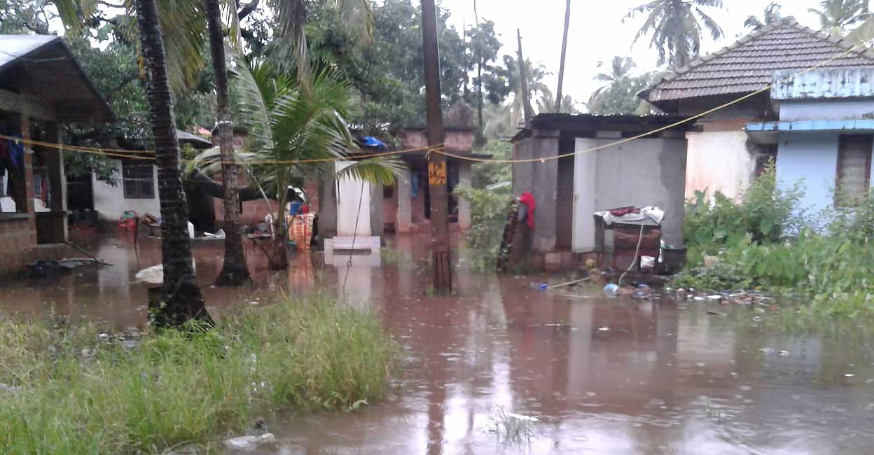 payyoli-irani-water-logging During monsoon, the residents of the Kabuli Colony carry their children on shoulders and wade through the toxic water to drop them at school. Photo: Special arrangement