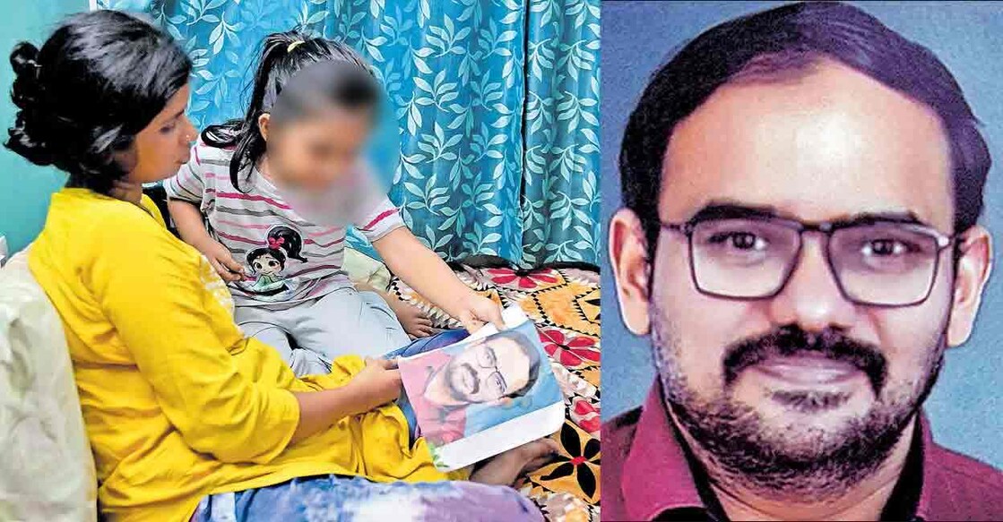 Nambi Rajesh's wife and child looks at his photo at their residence in Karamana. Photo: Manorama