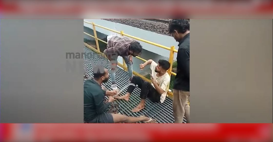 Screengrab of the goons assaulting the youth. Photo: Manorama News