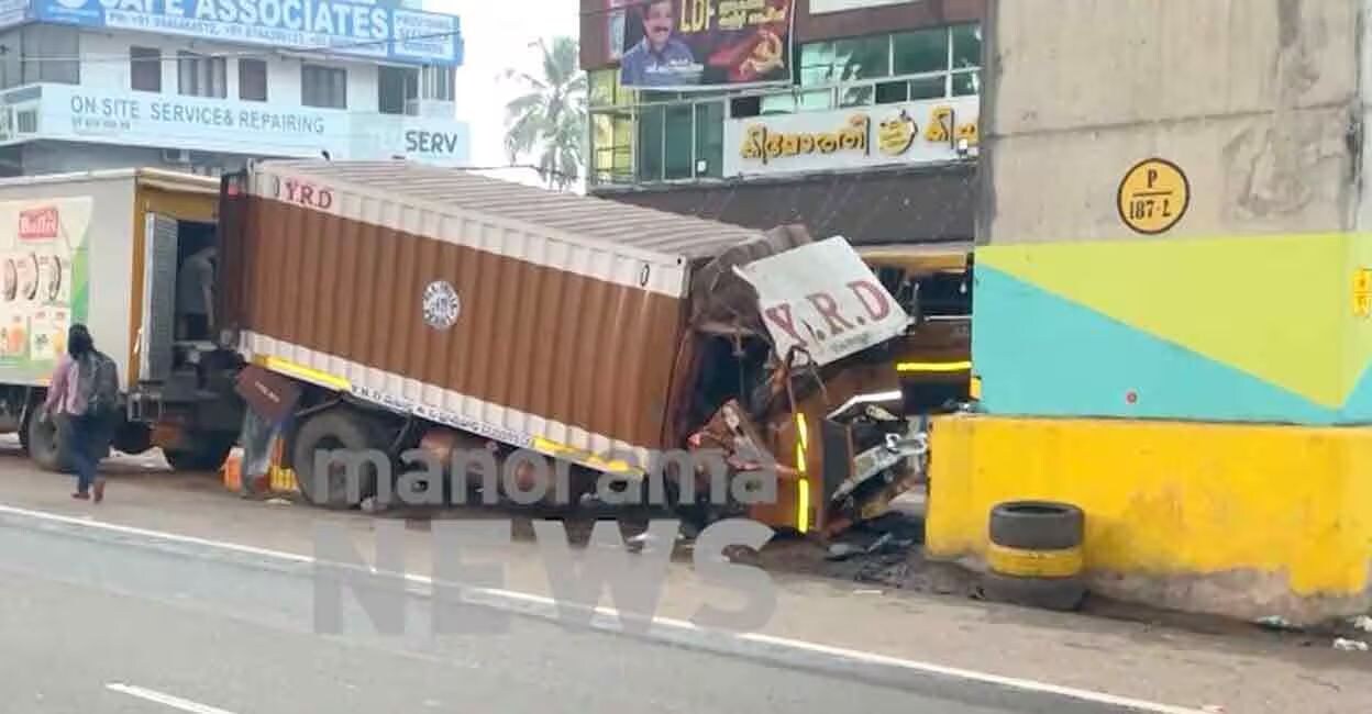 Lorry hits metro pillar in Aluva. Photo: Manorama News