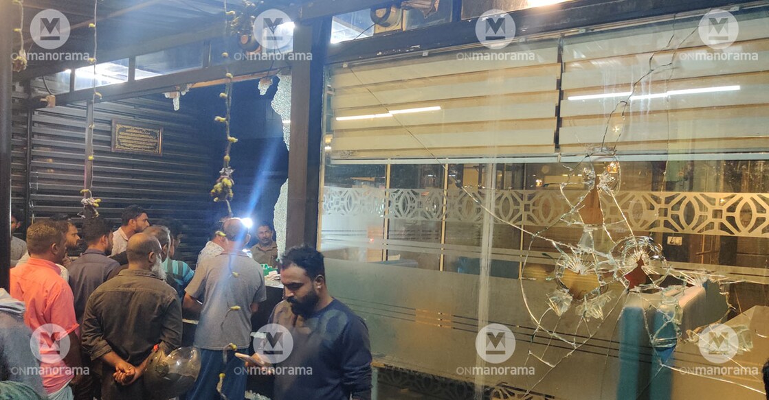 The glass walls of the restaurant were shattered using a steel rod. Photo: Mukesh Venu/Onmanorama