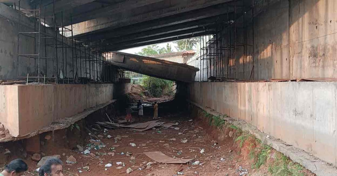 Concrete beam of a bridge under construction, as part of the National Highway 66, slipped off the pier at Pullur in Kasaragod. Photo: Special arrangement