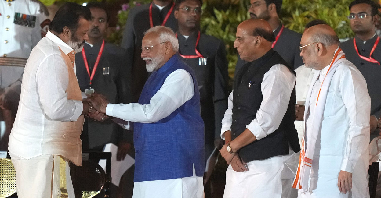 BJP MP Suresh Gopi greets Prime Minister Narendra Modi as party leaders Rajnath Singh and Amit Shah look on, at the swearing-in ceremony of the new Union government at Rashtrapati Bhavan, in New Delhi on June 9, 2024. Photo: PTI