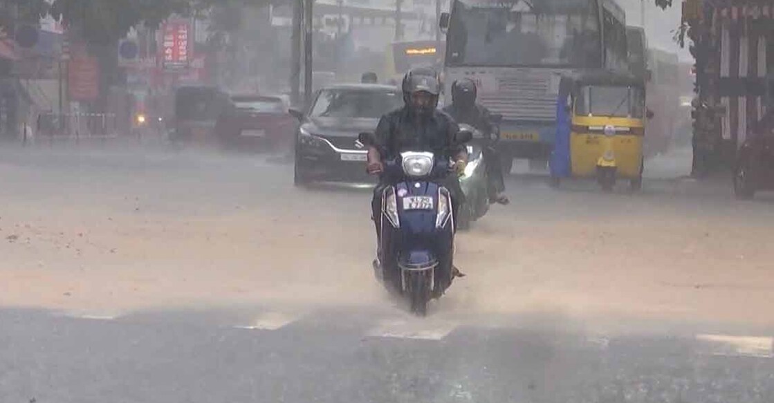 Man caught in heavy rain. Photo: Manorama News