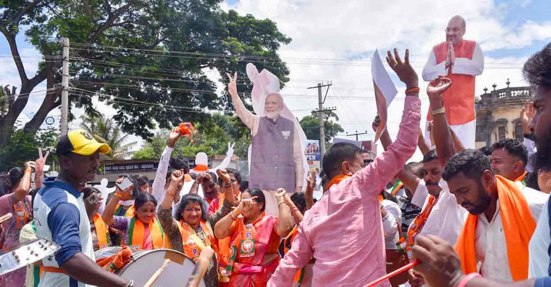  BJP workers celebrate the lead of party candidate from Udupi-Chikmagalur Lok Sabha constituency Kota Srinivas Poojari, in Chikkamagaluru, Tuesday, June 4, 2024. Photo: PTI