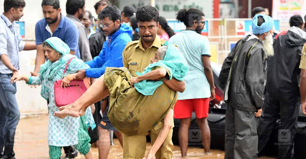 kerala-police-floods-ls A police officer during the 2018 Kerala floods rescue efforts. File Photo: Manorama.
