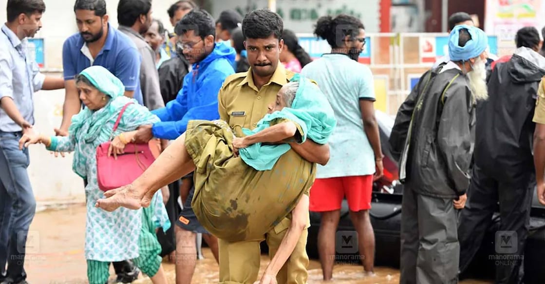 A police officer during the 2018 Kerala floods rescue efforts. File Photo: Manorama. 