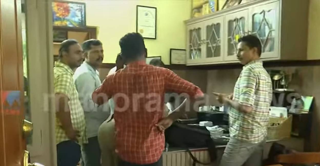 Police and other officials try to retrieve visuals from hardware of CCTV. Photo: Screengrab/ Manorama News