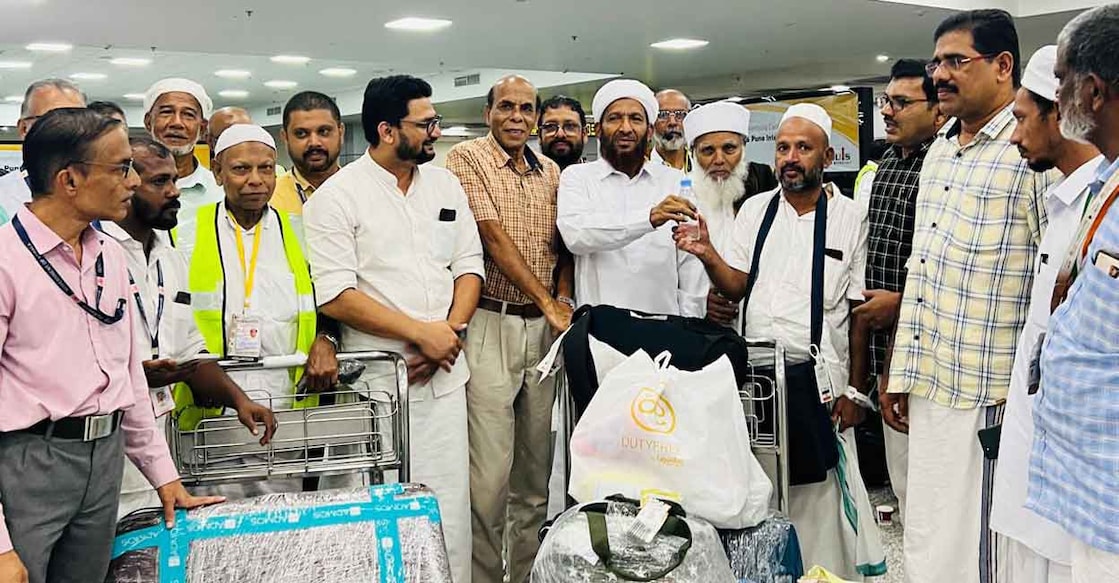 State Haj Committee Chairman C Muhammed Faizy recieving the pilgrims at the Kozhikode International Airport. Photo: Special arrangement
