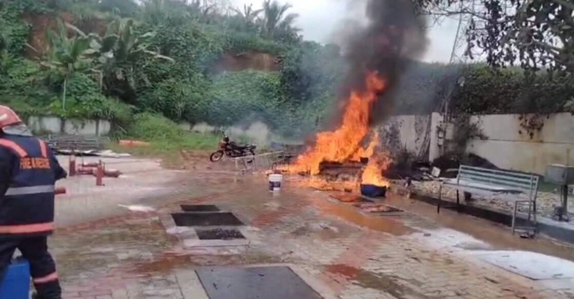 tsr-petrol-pump-fire-c Fire erupted from drainage water mixed with fuel. Photo: Special Arrangement