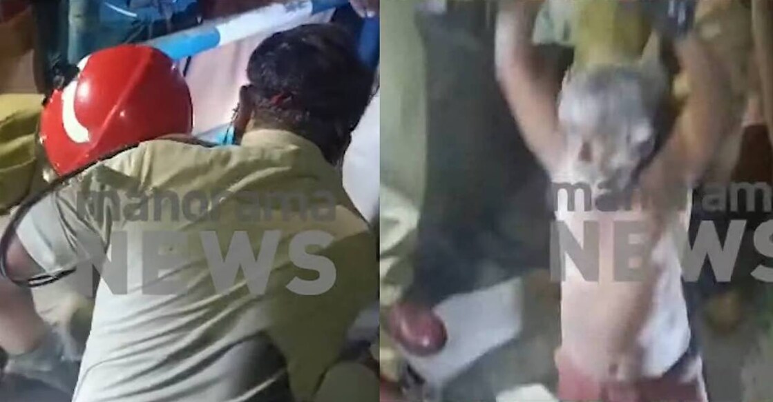 Fire force and police rescue the man from drainage. Photo: Screengrab/ Manorama News