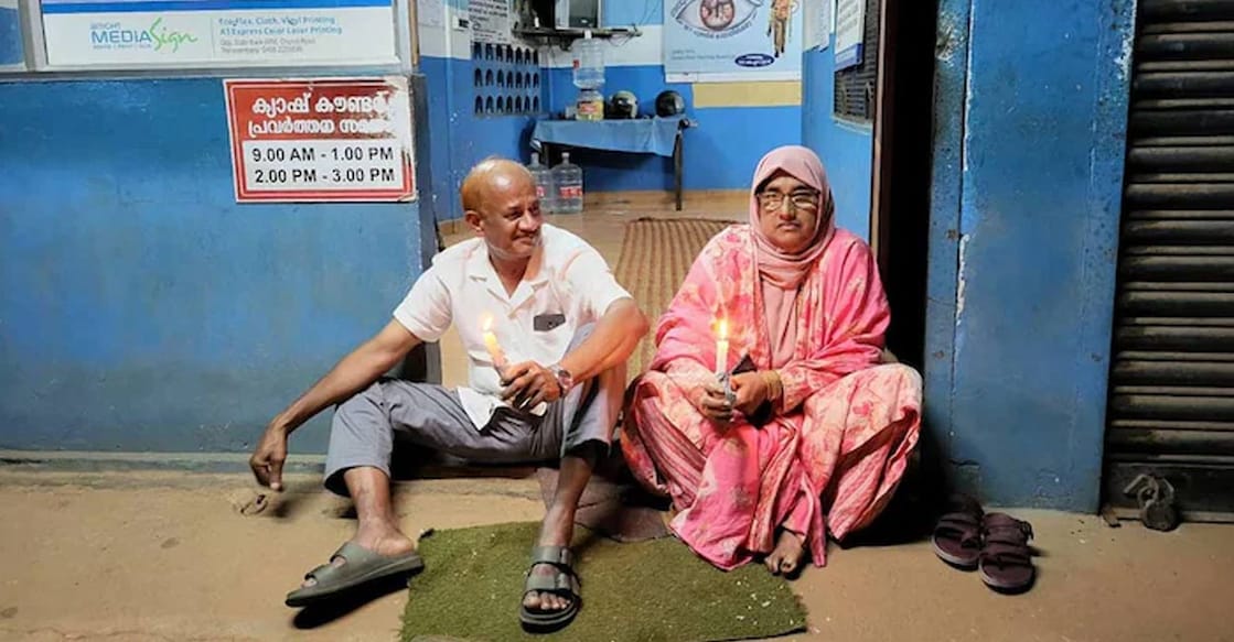razak-mariyam-ls Subsequently, Razak and his wife Mariyam protested in front of the KSEB section office by holding lit candles. Photo: Special arrangement.