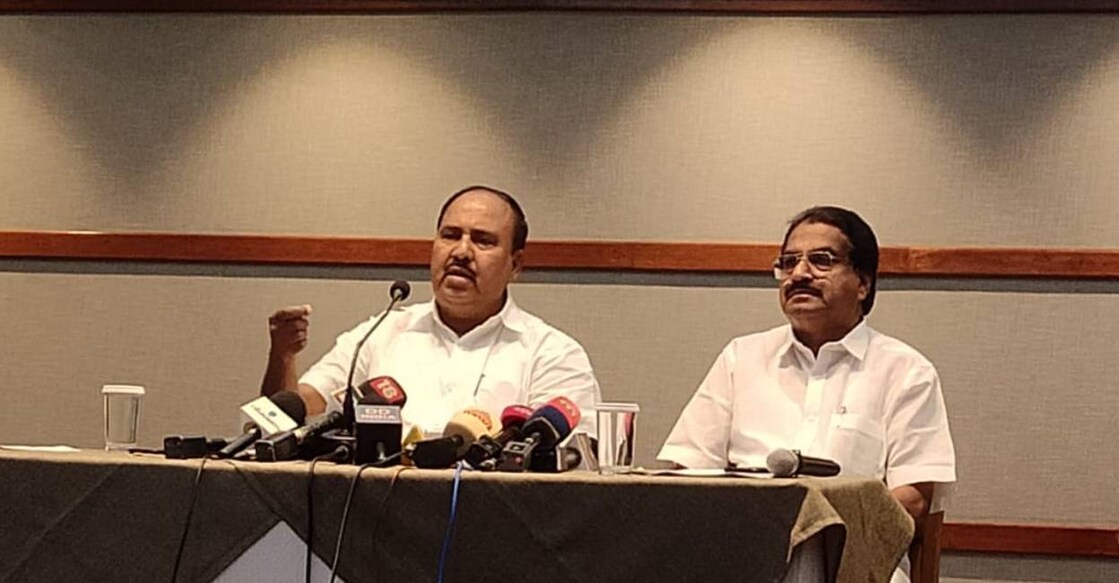 INTUC state president R Chandrasekharan addresses media in Kochi on Tuesday. On his left is INTUC district president Ibrahimkutty. Photo: Onmanorama
