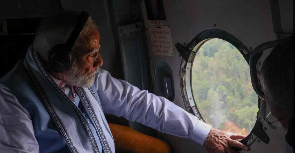 Prime Minister Narendra Modi conducts aerial survey. Photo: IANS
