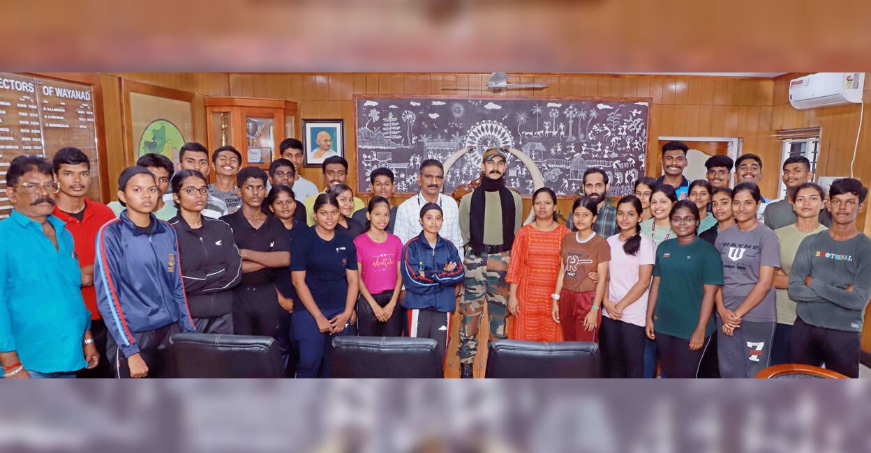 NCC cadets and officials of Nehru Arts and Science College, Coimbatore pose with Wayanad District Collector D R Meghashree at the Collectorate on Friday. Photo: Special arrangement