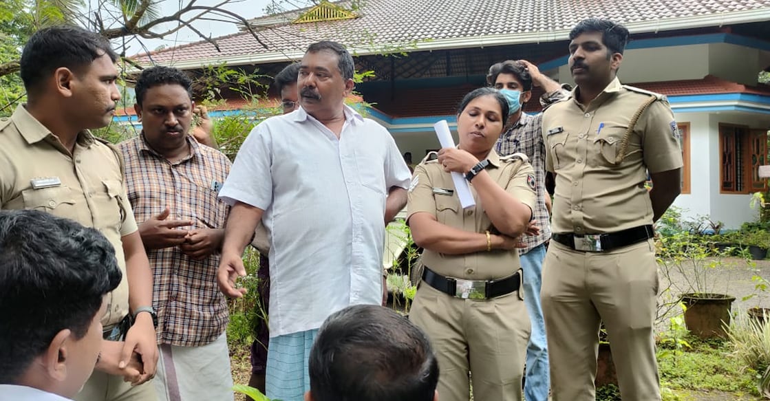 Balal Grama Panchayat President Raju Kattakkayam steps out for fresh air as Vigilance and Anti-Corruption Bureau officers search his Mallom residence for evidence of illegal wealth. – Photo: Sudheesh Pungamchal