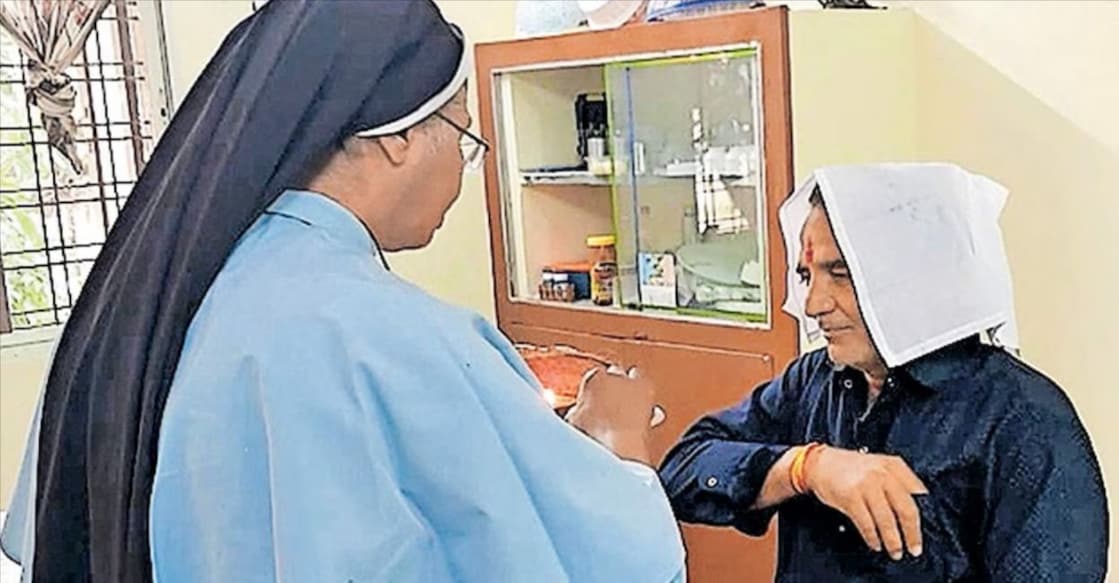 Sister Selmi ties a 'rakhi' around Samundar's wrist. Photo: Manorama