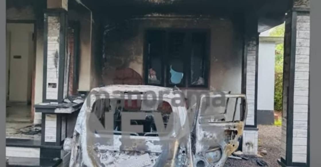 Car gutted in fire. Photo: Screengrab/ Manorama News