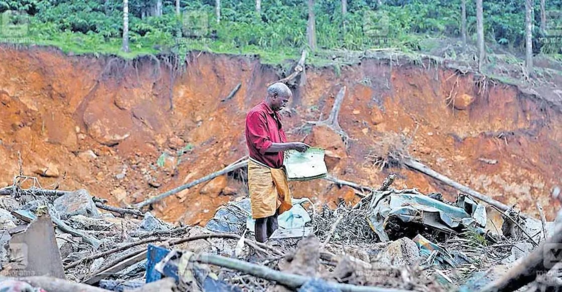Athanar, a survivor of the landslide at the place where his house was situated. Photo: Manorama