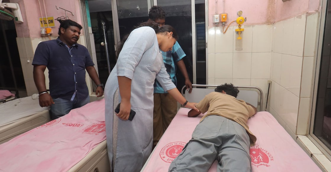 Mayor Arya Rajendran visits the injured Deepu at the General Hospital in Thiruvananthapuram. Photo: Special arrangement