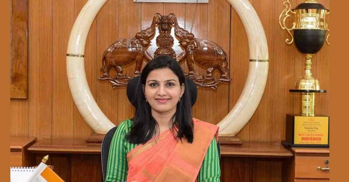 Widely circulated photograph of former District Collector Dr Renu Raj posing in front of the tusks. Photo: Facebook/Wayanad District Collector