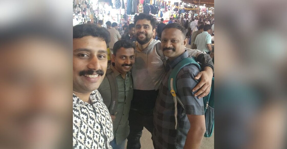 When the police officials from Elathur traced Vishnu (grey jacket), the missing army man, from a street in Bengaluru. Photo: Special Arrangement