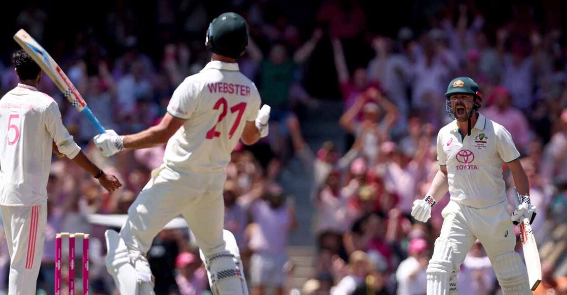 Australia’s Travis Head (R) and teammate Beau Webster react after they won the match on day three of the fifth cricket Test match between Australia and India at The SCG in Sydney. Photo by DAVID GRAY/AFP.