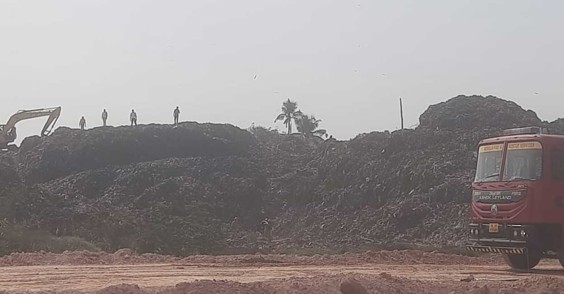 Three units of Fire and Rescue Services personnel contained the fire broke out at Brahmapuram waste dumping site on Friday. Photo: Special arrangement