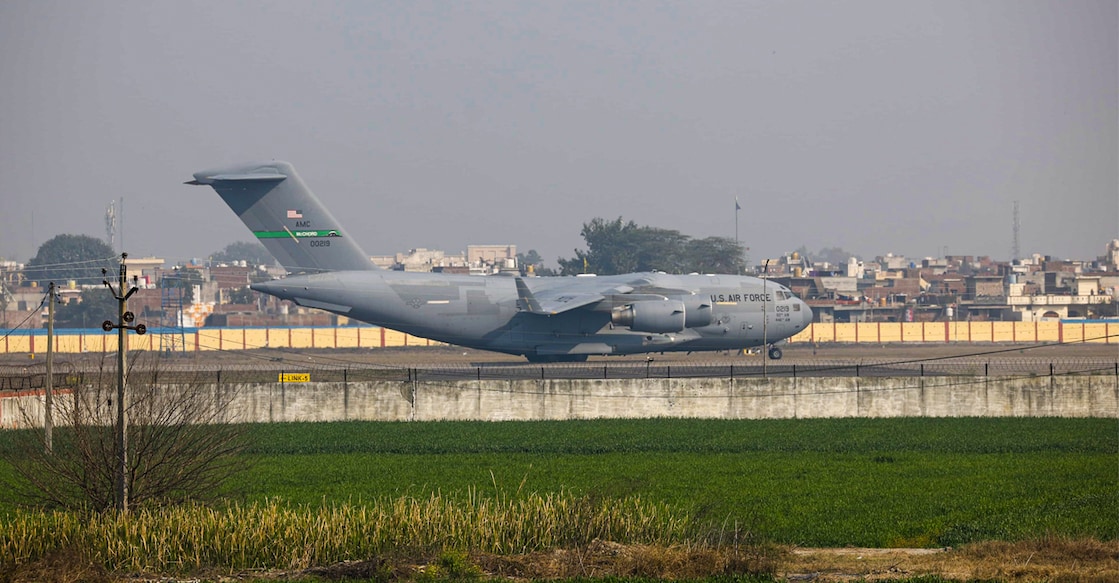 A US military aircraft carrying illegal Indian immigrants upon its landing at the Shri Guru Ramdas Ji International Airport, in Amritsar. Photo: Shiva Sharma/PTI