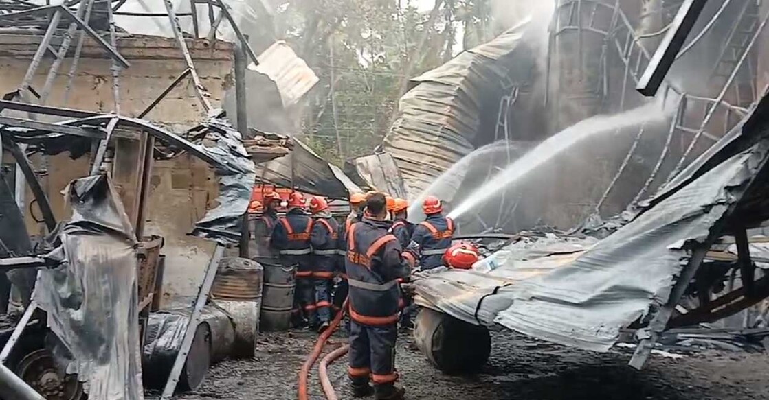fire-thrissur Firefighters trying to contain the fire in this picture taken from a video.