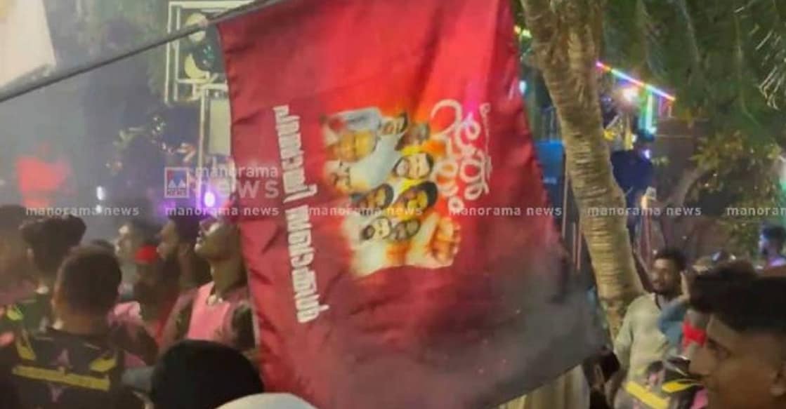 This time, CPM supporters marched with flags bearing the faces of nine party workers convicted just a week ago for murdering BJP activist Suraj at Muzhappilangad in 2005. Photo: Screengrab/ Manorama News.